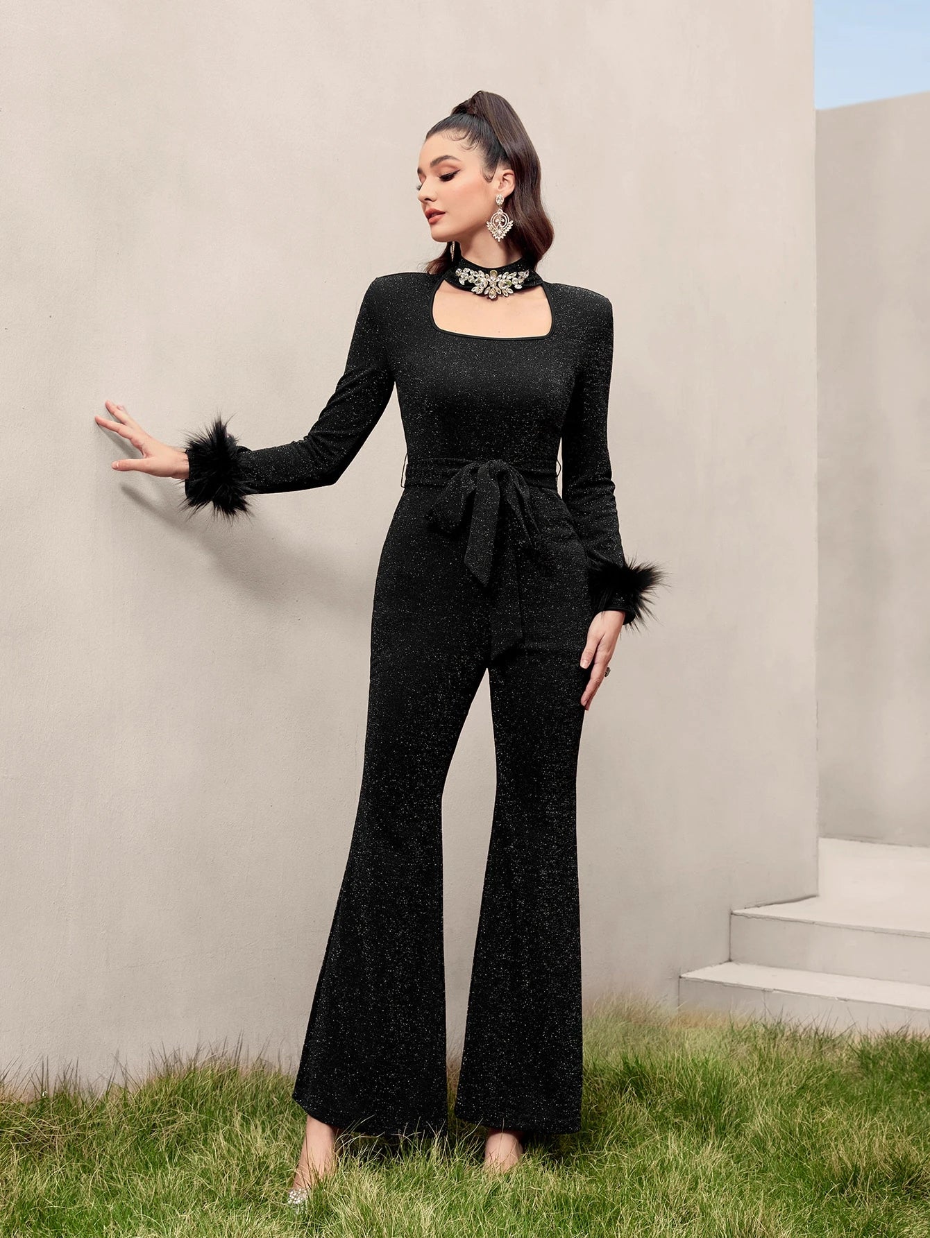 Modelyn Fuzzy Cuff Belted Glitter Flare Leg Jumpsuit