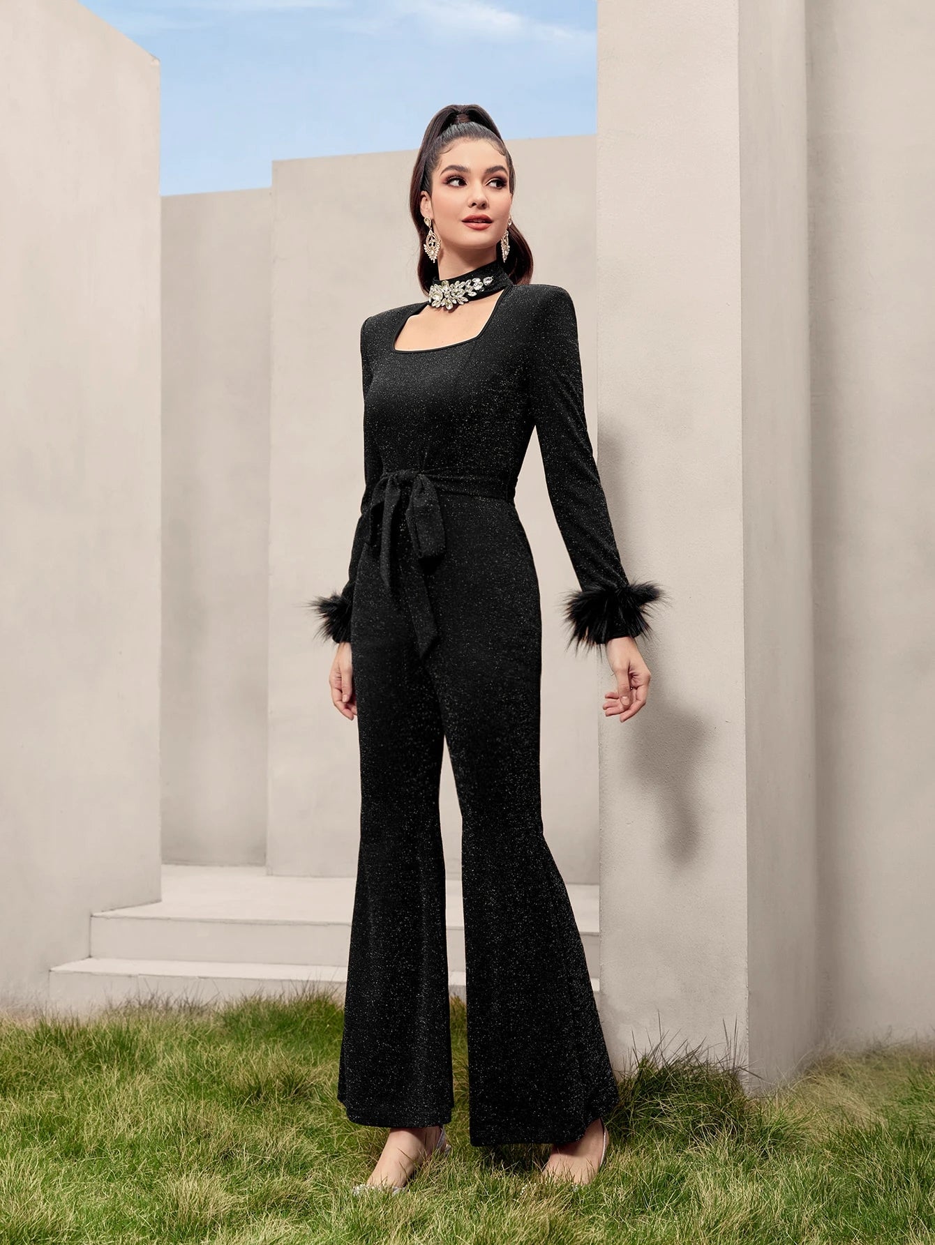 Modelyn Fuzzy Cuff Belted Glitter Flare Leg Jumpsuit