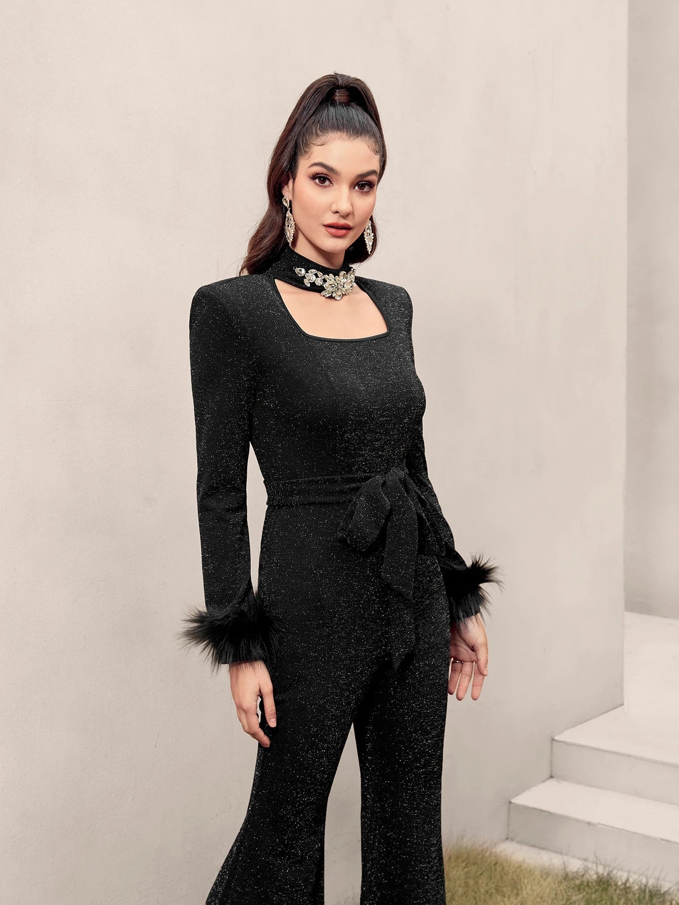 Modelyn Fuzzy Cuff Belted Glitter Flare Leg Jumpsuit